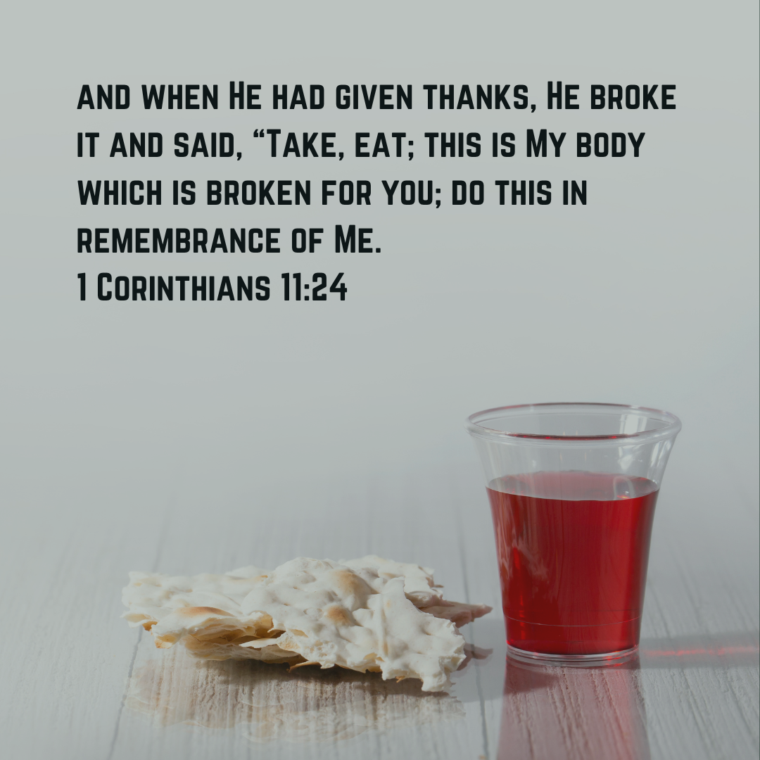 Communion cup and bread with the bible verse 1 Corinthians 11:24 overlaid on the image